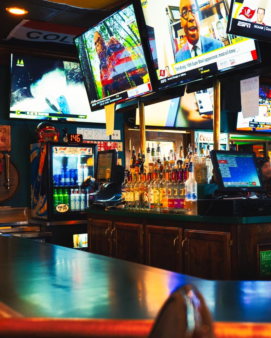Harmon's Pub bar with TVs